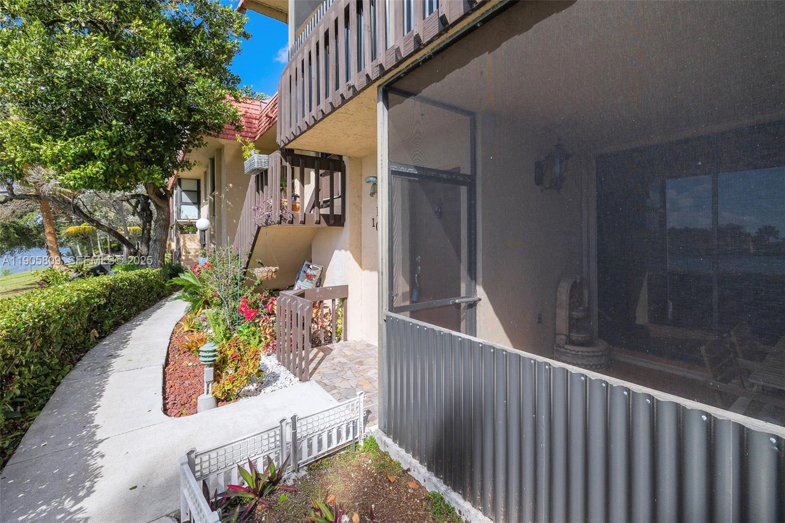 770 Northeast 199th Street, Unit 106F Miami, FL 33179 - Photo 20 of 25 a garden view with a sitting space