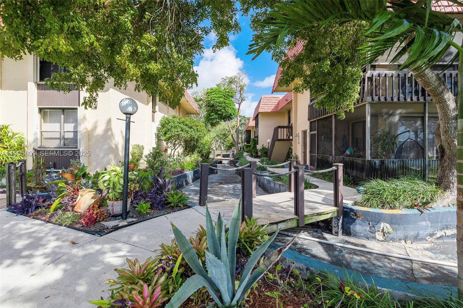 770 Northeast 199th Street, Unit 106F Miami, FL 33179 - Photo 21 of 25 a view of a street with sitting area