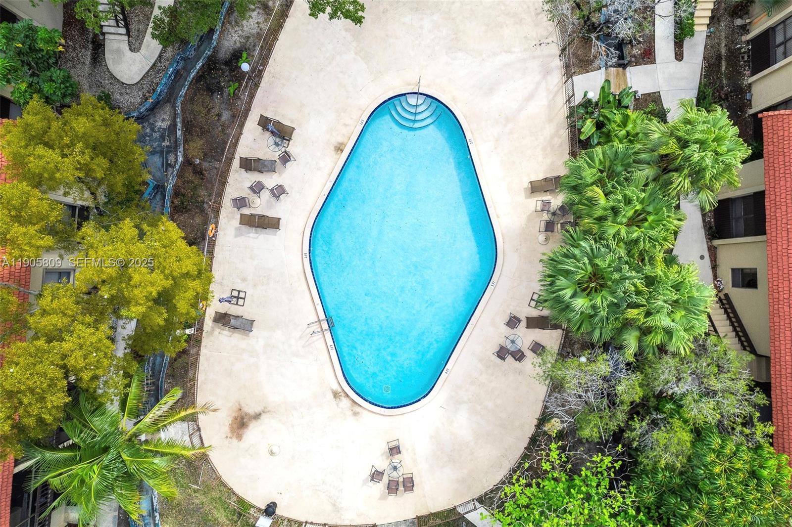 770 Northeast 199th Street, Unit 106F Miami, FL 33179 - Photo 22 of 25 an aerial view of a swimming pool