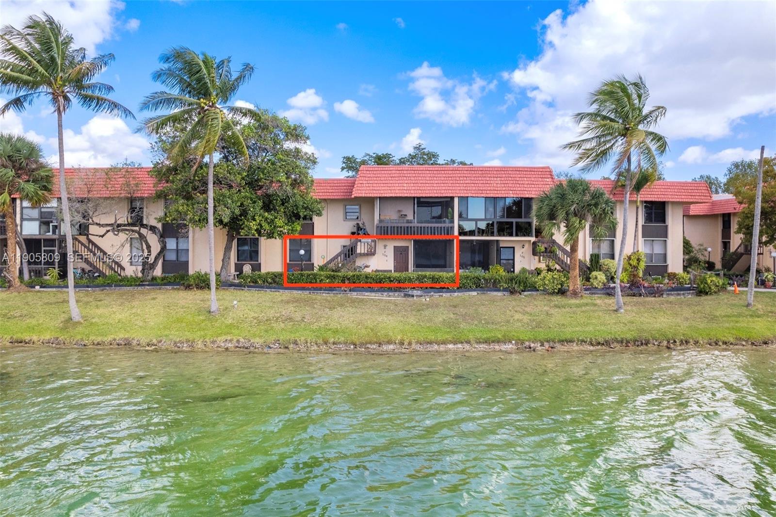 770 Northeast 199th Street, Unit 106F Miami, FL 33179 - Photo 6 of 25 a view of a house with a swimming pool