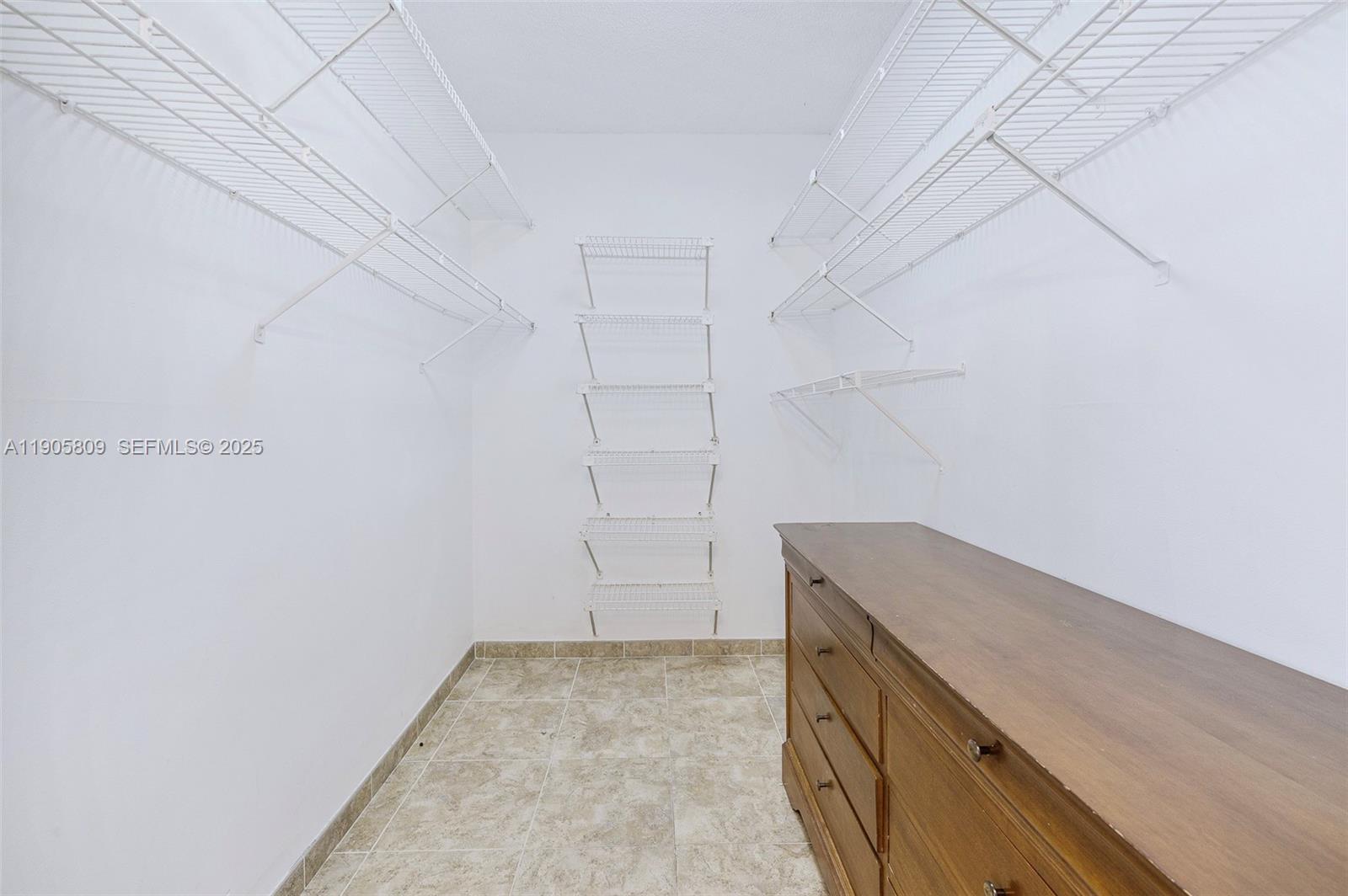 770 Northeast 199th Street, Unit 106F Miami, FL 33179 - Photo 10 of 25 a view of storage and utility room