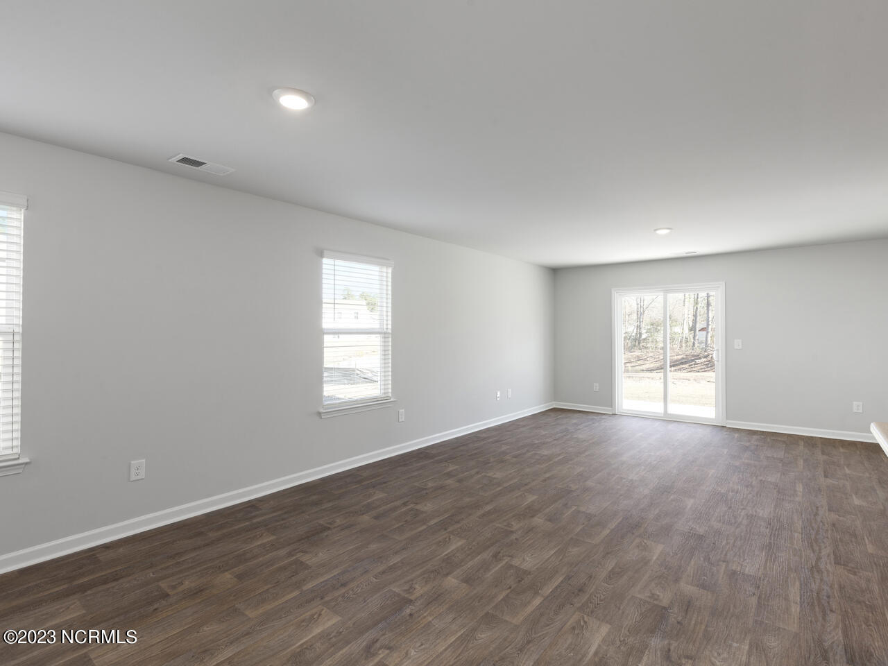 398 Folkstone Road, Unit LOT 1005 Holly Ridge, NC 28445 - Photo 15 of 37 living and dining area