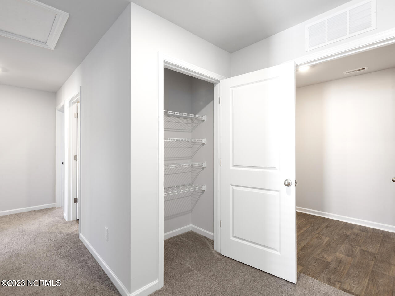 398 Folkstone Road, Unit LOT 1005 Holly Ridge, NC 28445 - Photo 25 of 37 linen closet upstairs next to laundry room