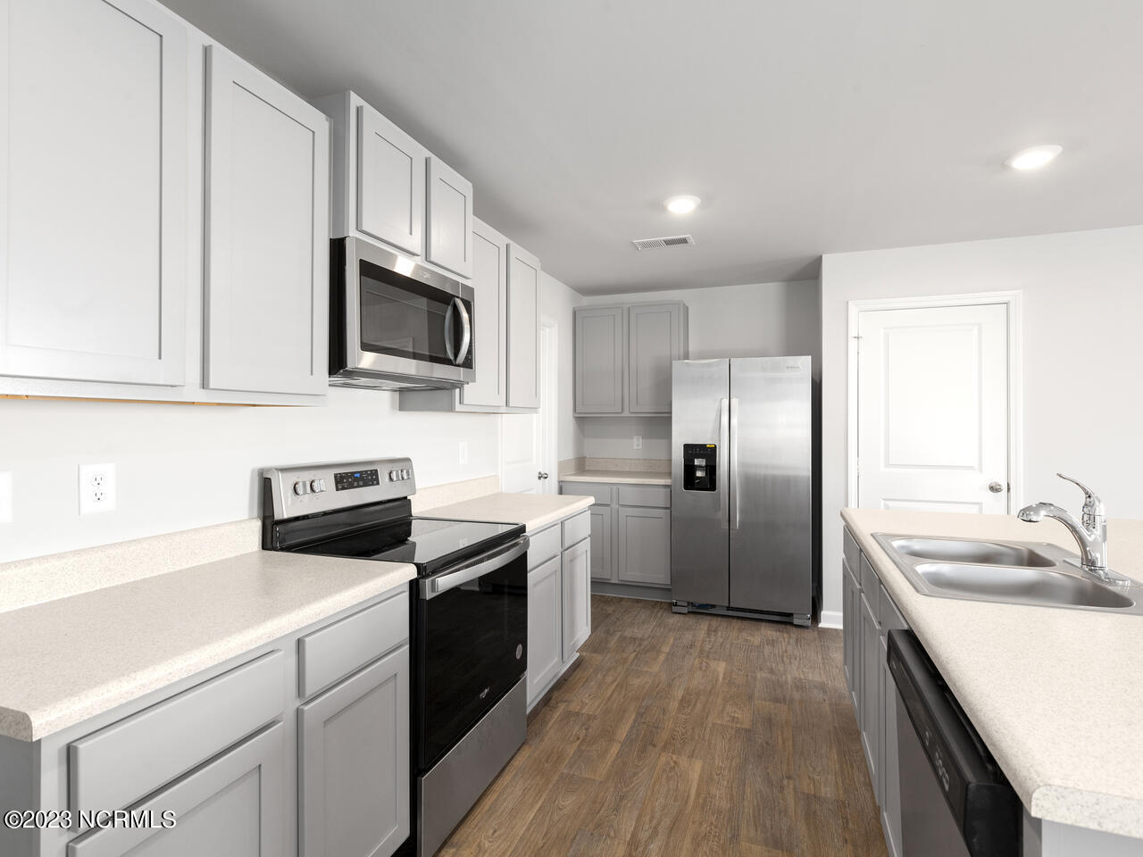 398 Folkstone Road, Unit LOT 1005 Holly Ridge, NC 28445 - Photo 7 of 37 refrigerator not included, garage entry from kitchen