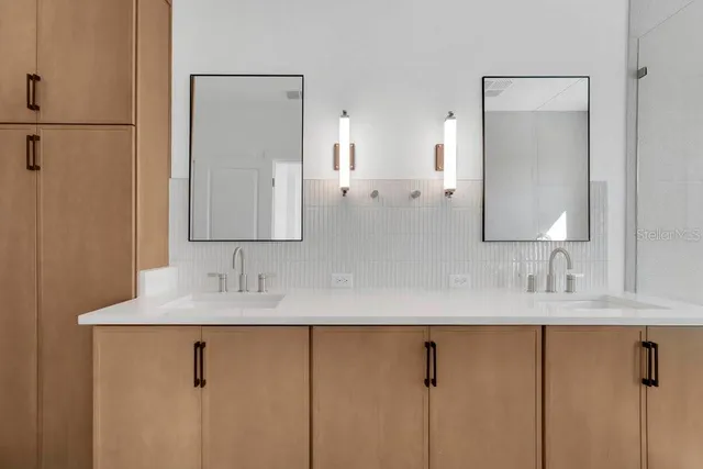 a bathroom with a sink and a mirror