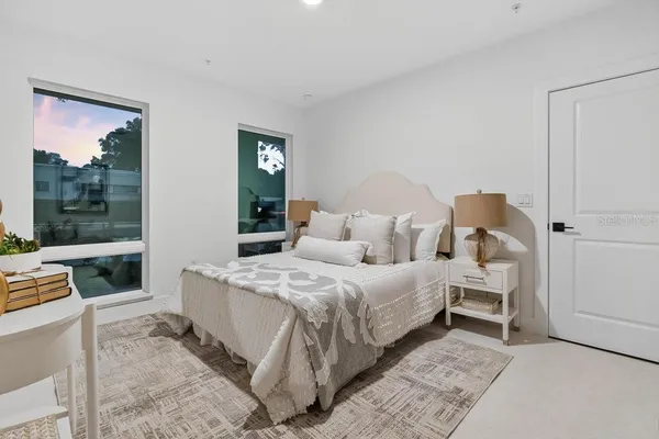 a bed room with a bed and a window