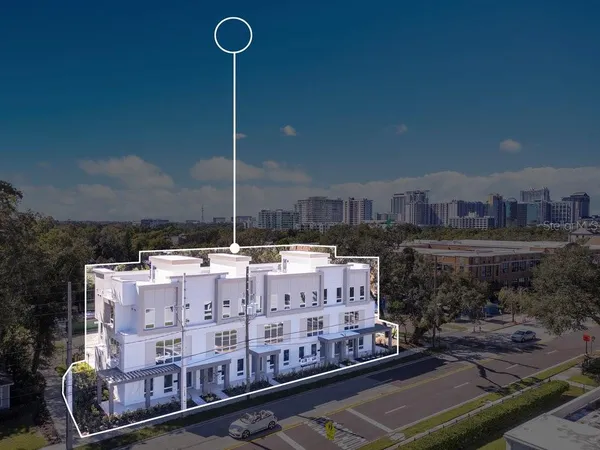 a large white building with a view of city