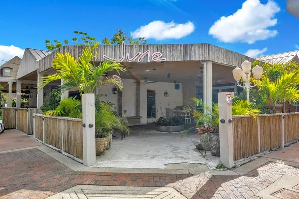 a view of a swimming pool with outdoor seating