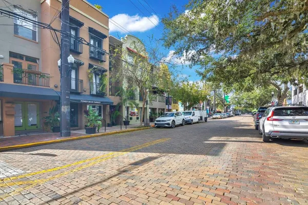 a view of a street with sitting area