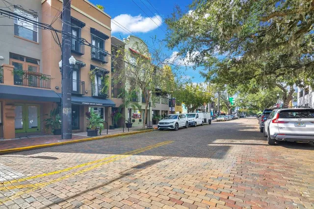 a view of a street with cars