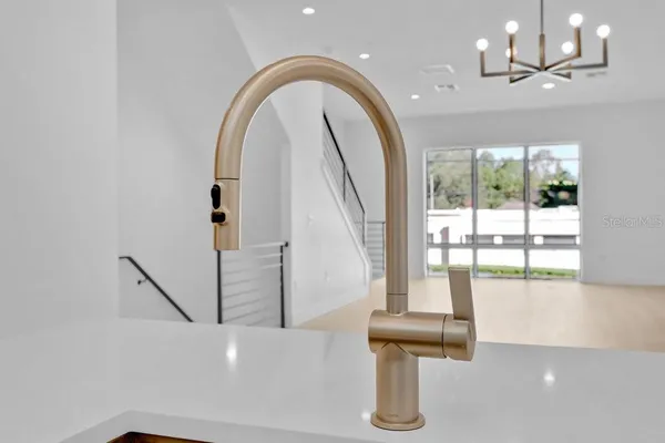 a view of entryway and hall with a view of living room