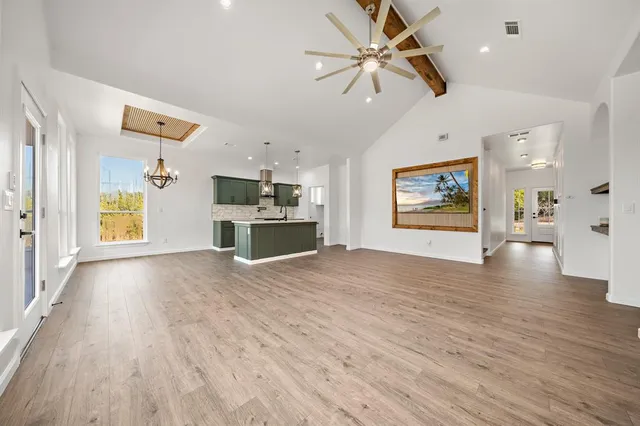 a kitchen with stainless steel appliances granite countertop a sink a counter space appliances and cabinets