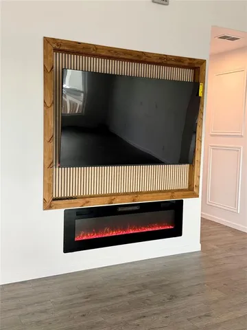 a kitchen with stainless steel appliances kitchen island granite countertop a sink and a stove top oven