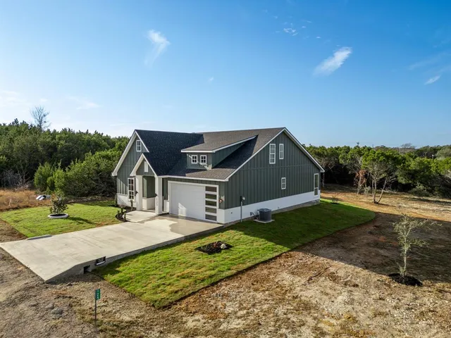 a house view with a garden space
