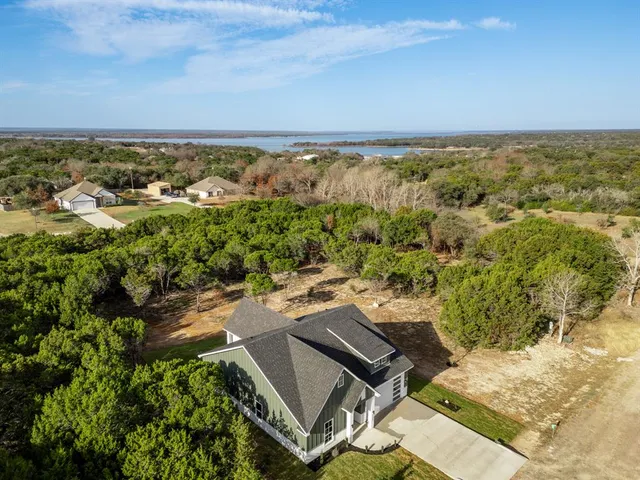 an aerial view of residential house with outdoor space