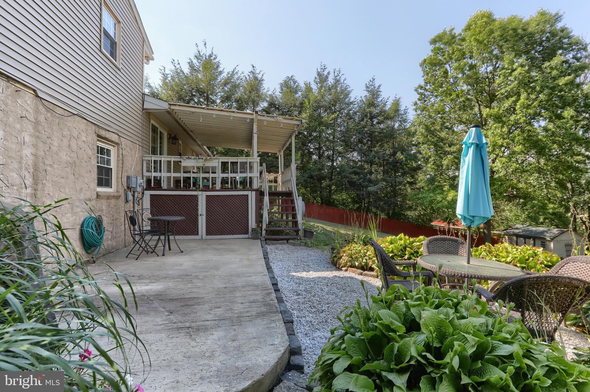 1586 Loop Road Manheim, PA 17545 - Photo 39 of 42 a view of a patio with table and chairs potted plants