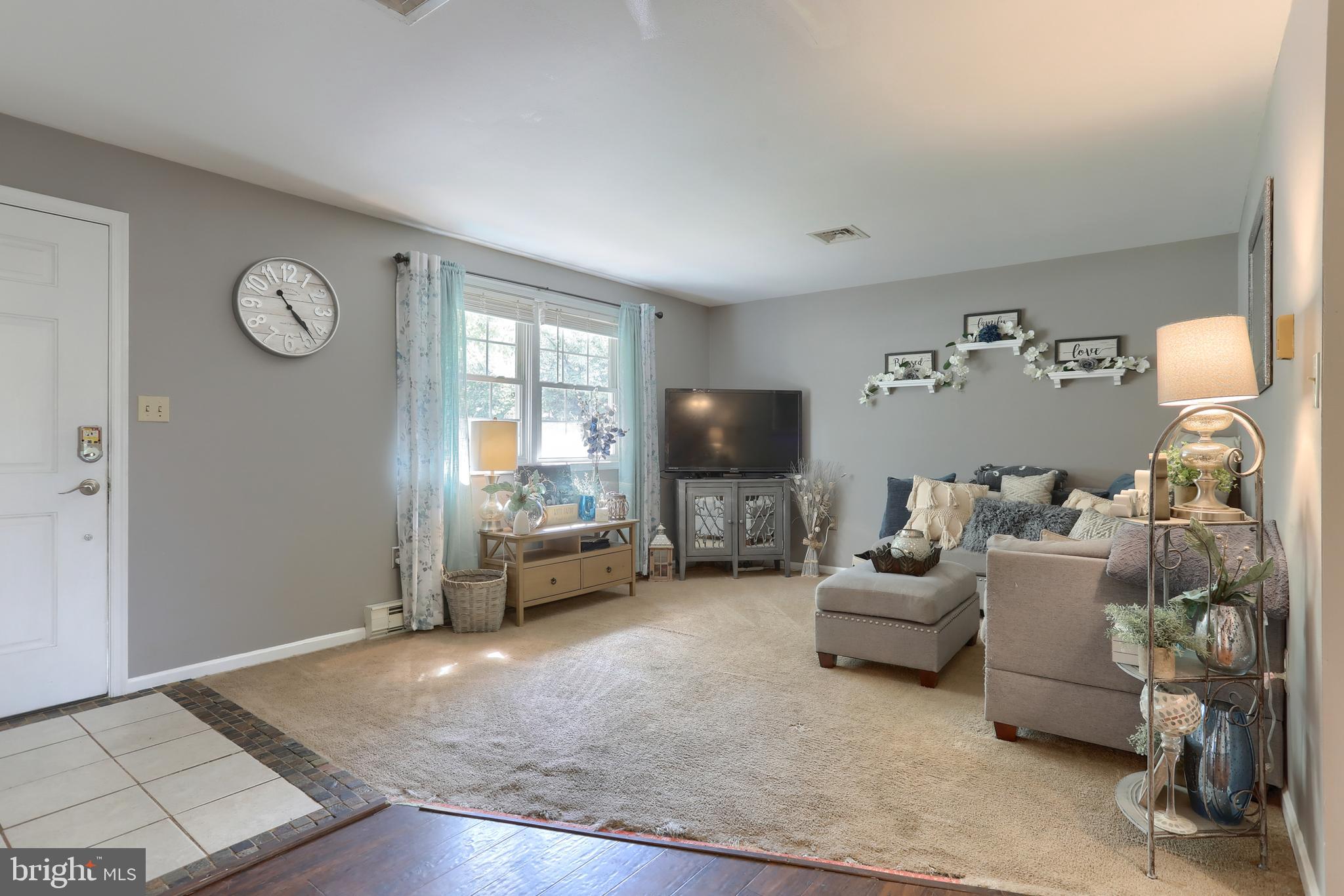 1586 Loop Road Manheim, PA 17545 - Photo 9 of 42 a living room with furniture and a flat screen tv