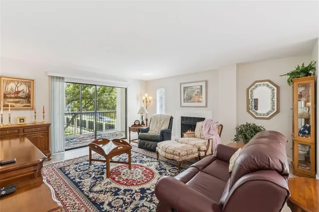 a living room with furniture or couch and a large window