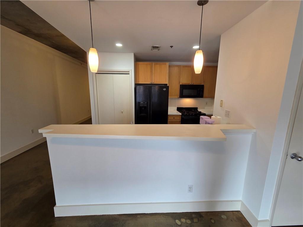 845 Spring Street Northwest, Unit 104 Atlanta, GA 30308 - Photo 13 of 40 a view of a house with a and a ceiling fan