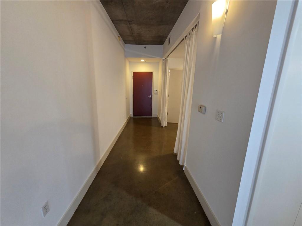 845 Spring Street Northwest, Unit 104 Atlanta, GA 30308 - Photo 17 of 40 a view of a hallway with wooden floor