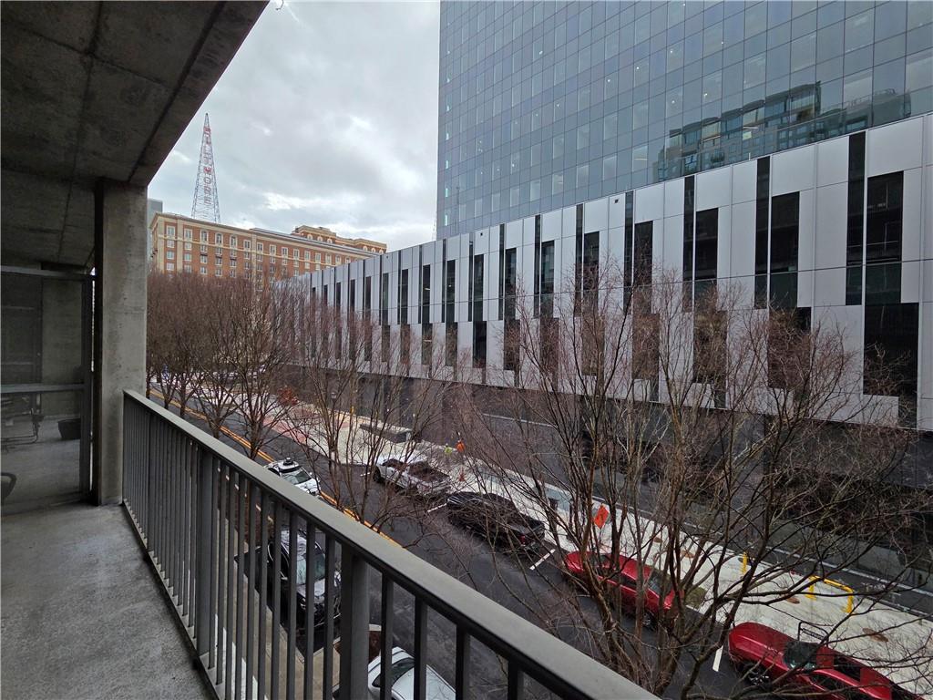 845 Spring Street Northwest, Unit 104 Atlanta, GA 30308 - Photo 20 of 40 a view of balcony and wooden fence