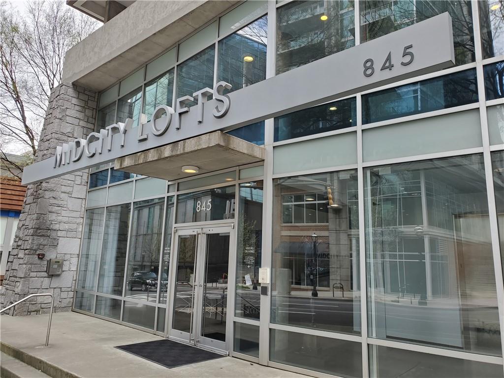 845 Spring Street Northwest, Unit 104 Atlanta, GA 30308 - Photo 29 of 40 a front view of a building with glass windows