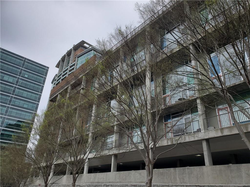845 Spring Street Northwest, Unit 104 Atlanta, GA 30308 - Photo 39 of 40 a view of a house with a tree
