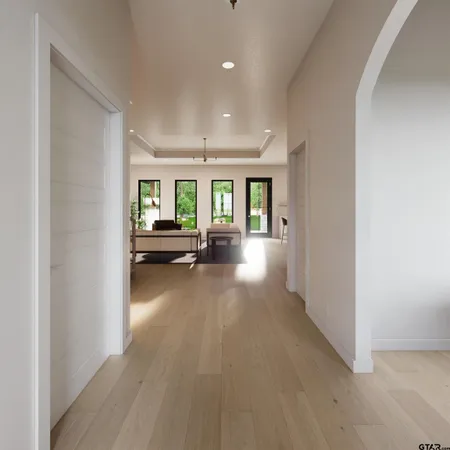 a view of a livingroom with furniture hardwood floor and a living room