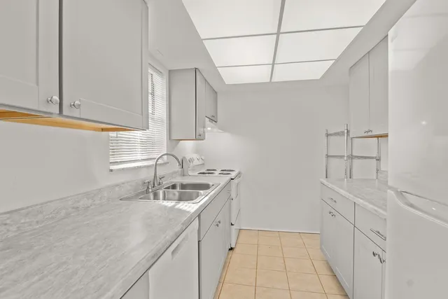 a kitchen with a sink and cabinets