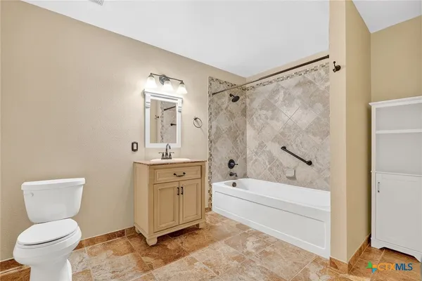 a view of a porch with furniture and a yard