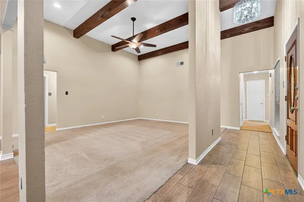 a large bathroom with a granite countertop sink a large mirror and a shower
