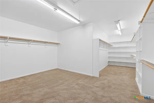 a bathroom with a toilet a sink and a mirror