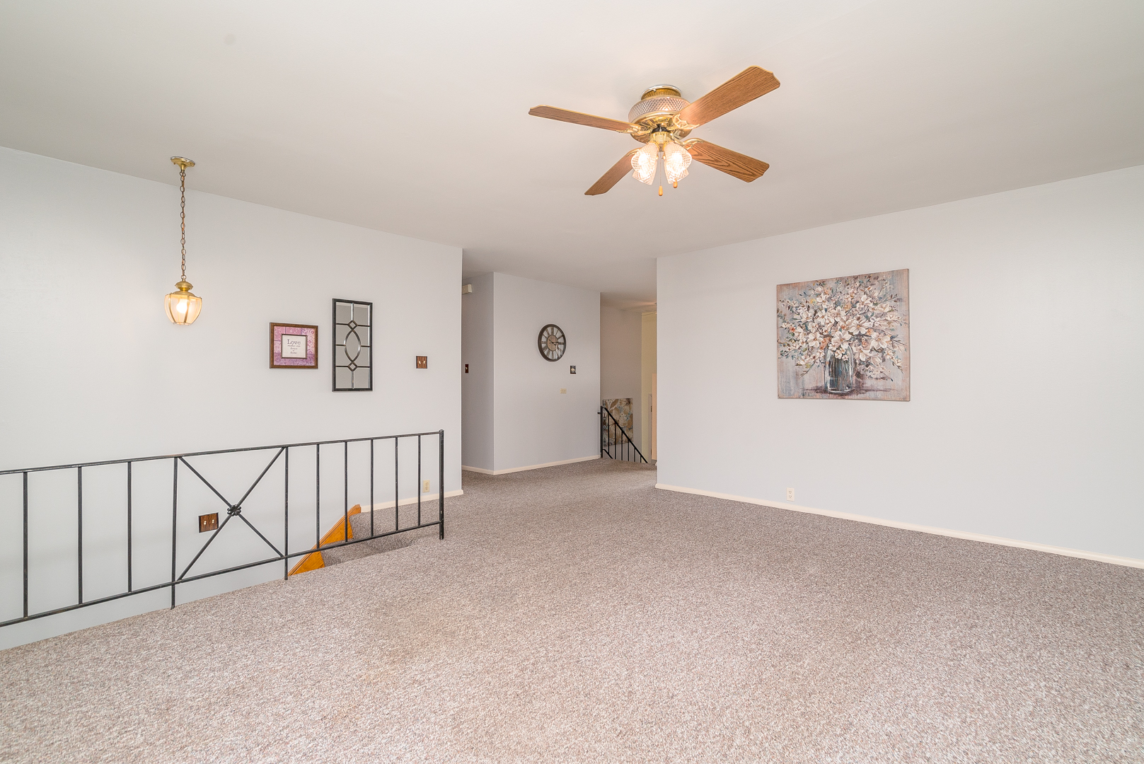 9 Ambassador Avenue Romeoville, IL 60446 - Photo 11 of 26 a view of a livingroom with a ceiling fan