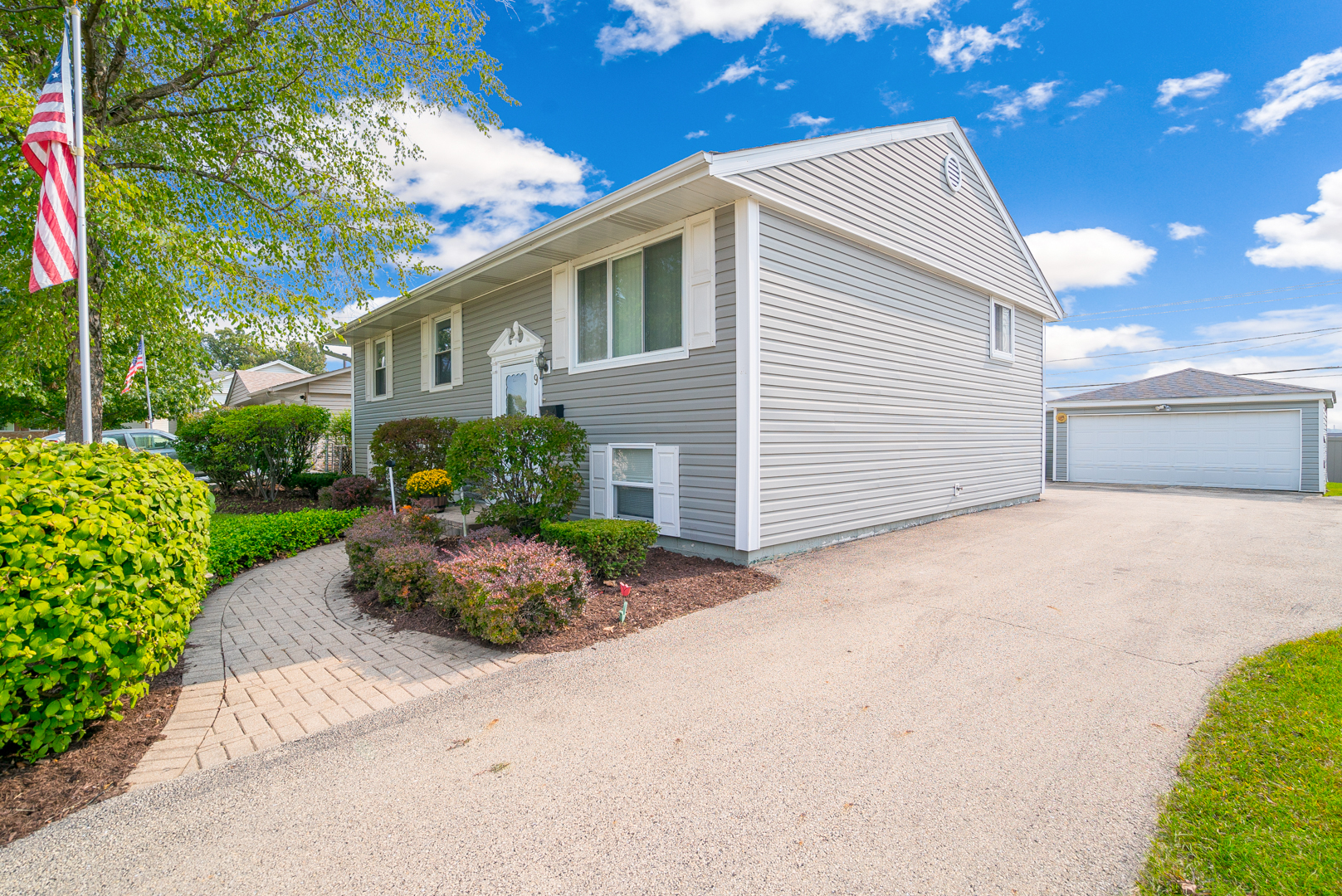 9 Ambassador Avenue Romeoville, IL 60446 - Photo 26 of 26 a front view of a house with a yard and a garage