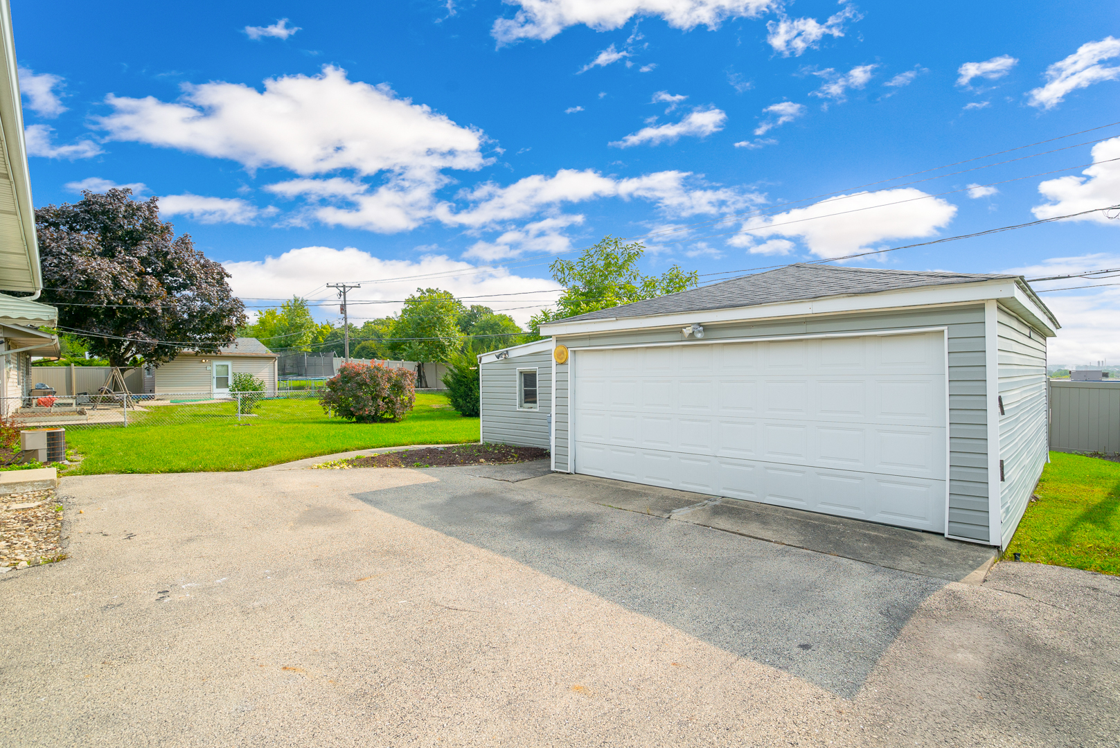 9 Ambassador Avenue Romeoville, IL 60446 - Photo 5 of 26 a view of a house with a yard and garage