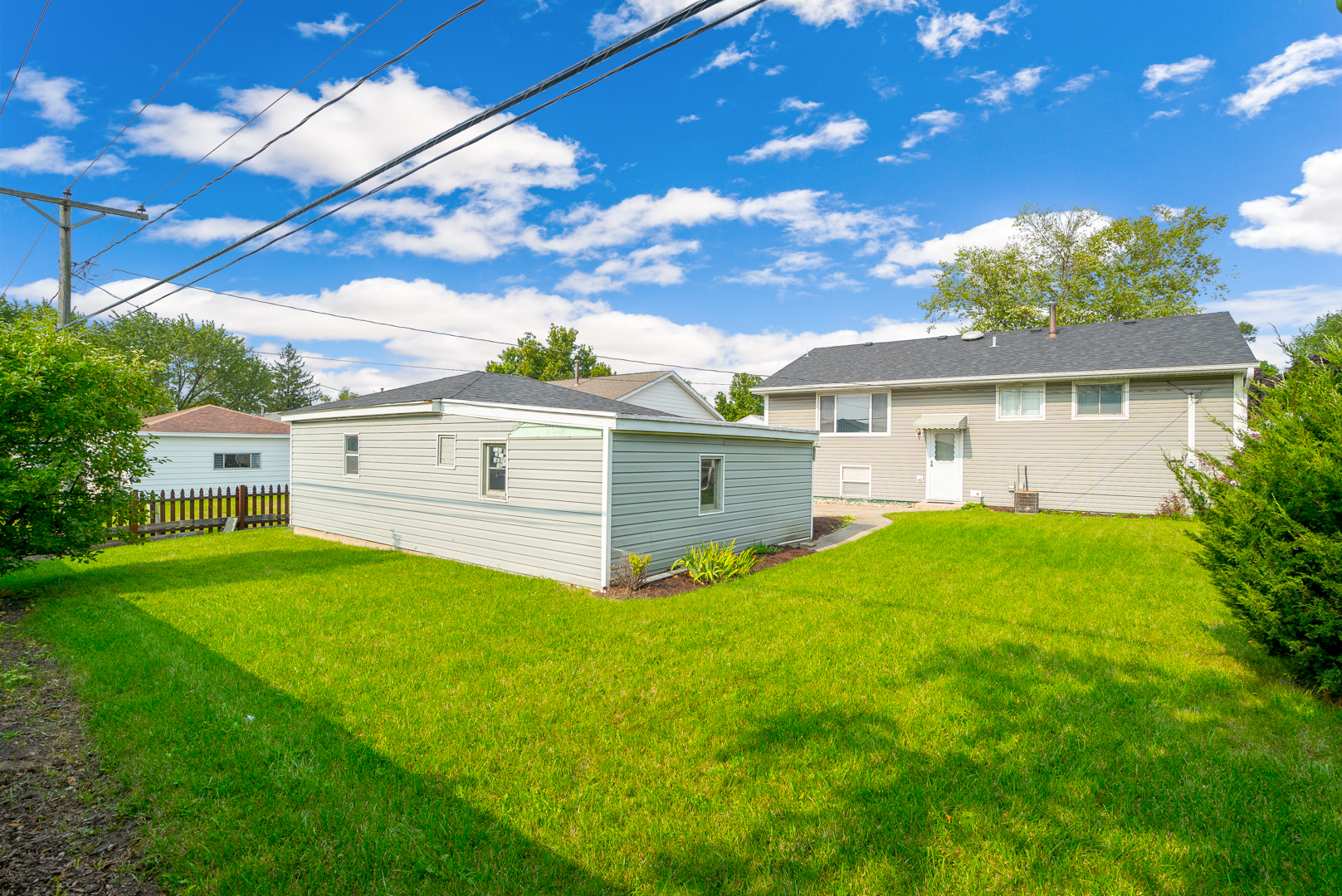 9 Ambassador Avenue Romeoville, IL 60446 - Photo 7 of 26 a front view of a house with garden