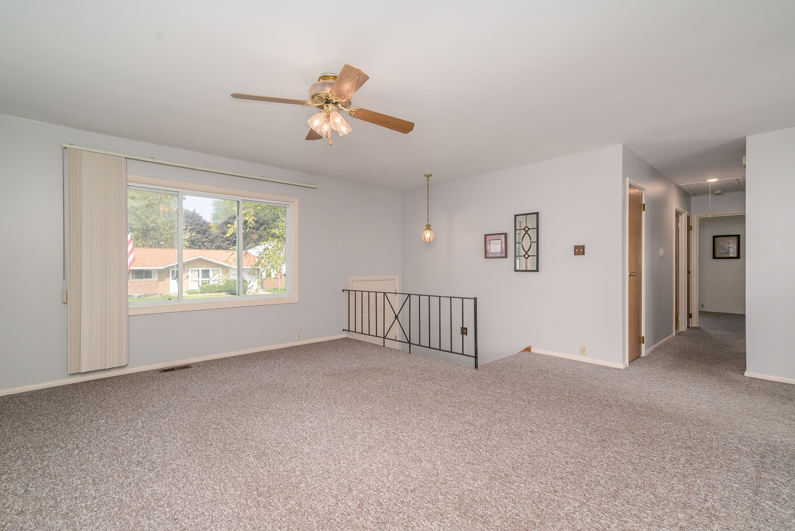 9 Ambassador Avenue Romeoville, IL 60446 - Photo 9 of 26 a view of a livingroom with a ceiling fan and window