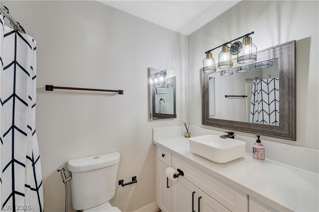 1331 Pinto Road Boulder City, NV 89005 - Photo 30 of 46 A vessel sink and modern lighting elevate this well-appointed bathroom.