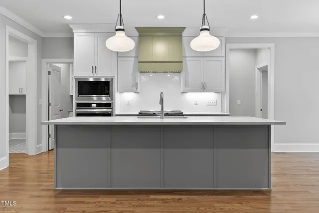 a bathroom with a shower and a glass door
