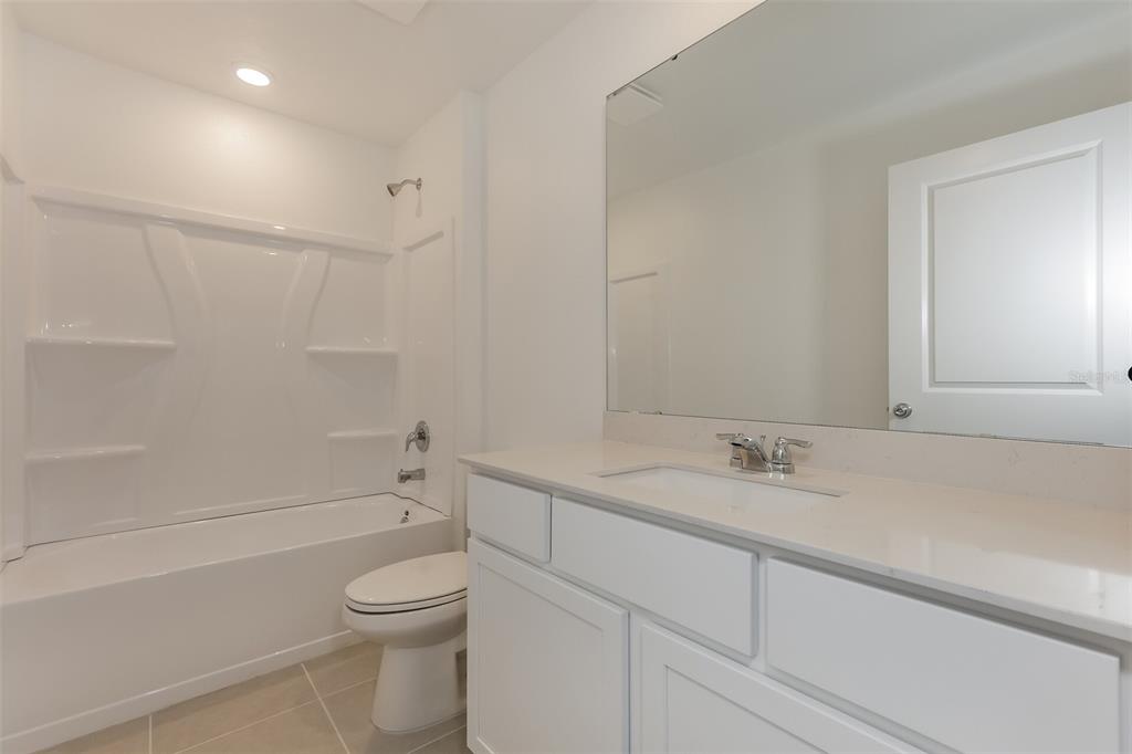 2770 Pennachio Dr Lake Lake Wales, FL 33853 - Photo 12 of 15 a bathroom with a sink a toilet and shower