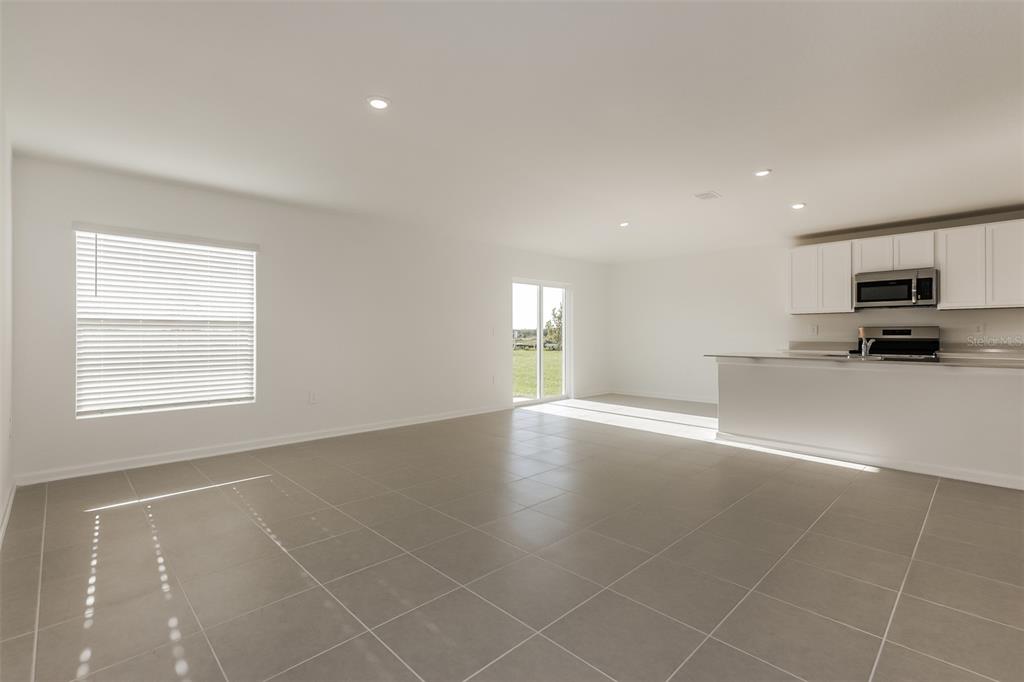 2770 Pennachio Dr Lake Lake Wales, FL 33853 - Photo 3 of 15 a view of an empty room with kitchen and window