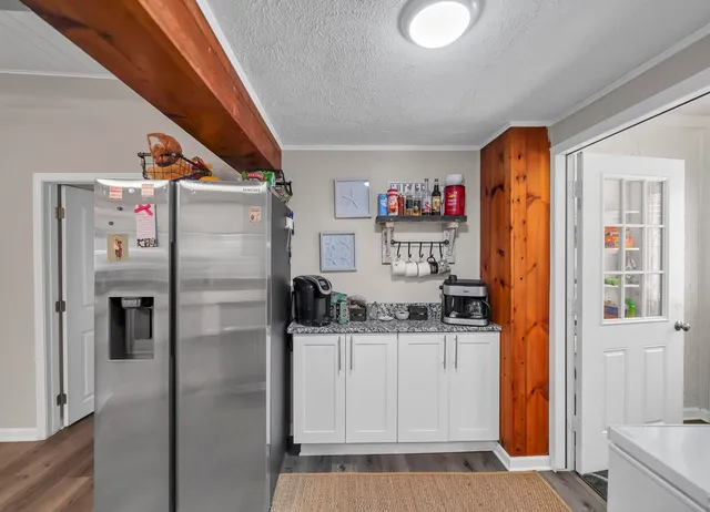 a kitchen with stainless steel appliances a refrigerator and a sink