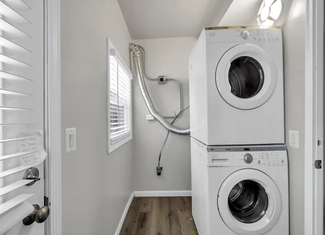 a view of a hallway with washer and dryer