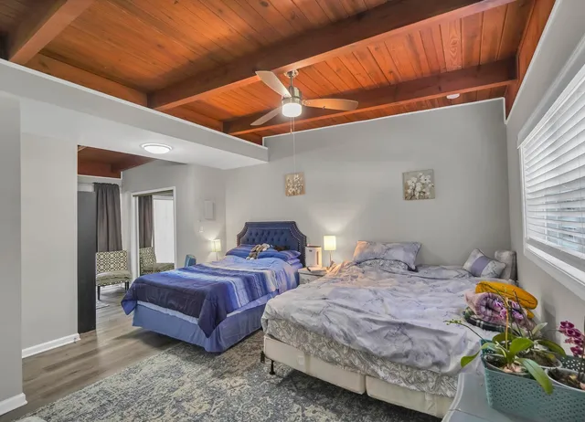 a bedroom with bed and a window