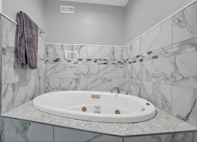 a bath tub sitting in a bathroom