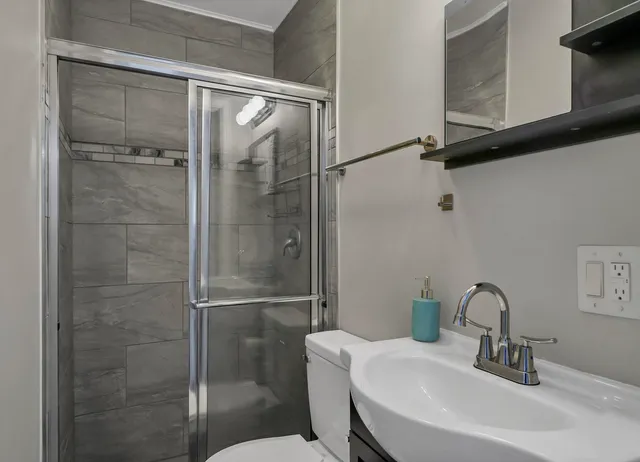 a bathroom with a sink and mirror