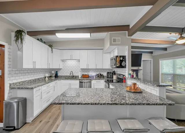 a kitchen with lots of counter space and a sink