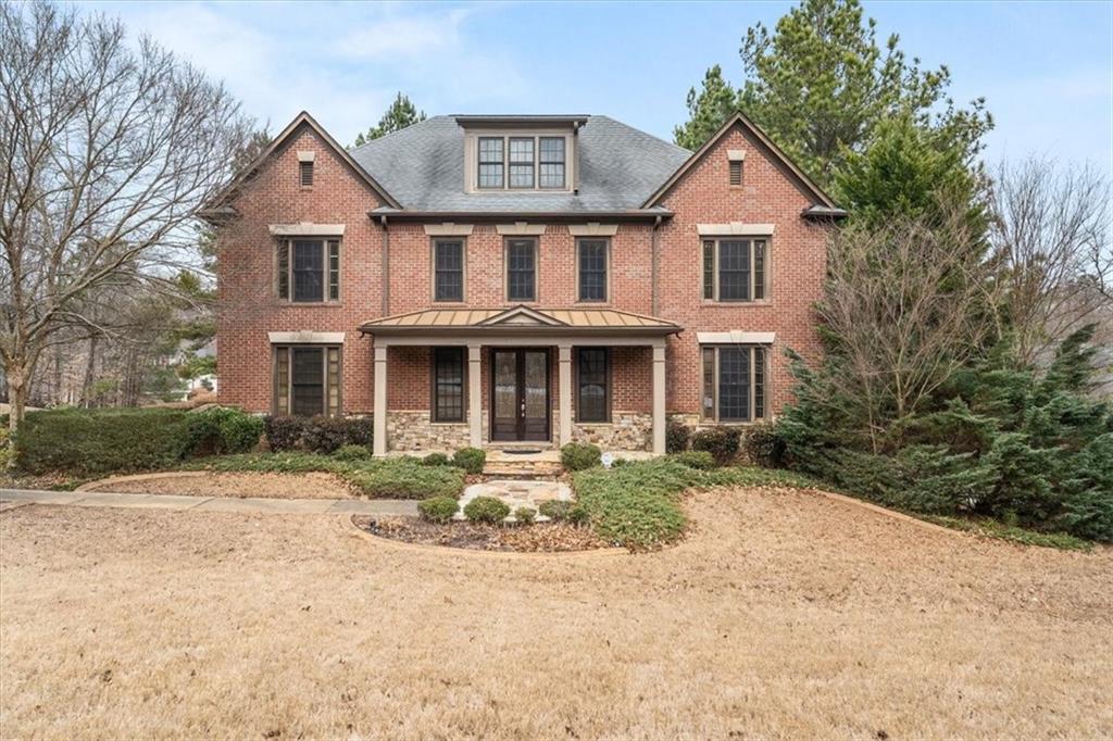 810 Forest Crossing Drive Southwest Atlanta, GA 30331 - Photo 1 of 1 a front view of a house with a yard and garage