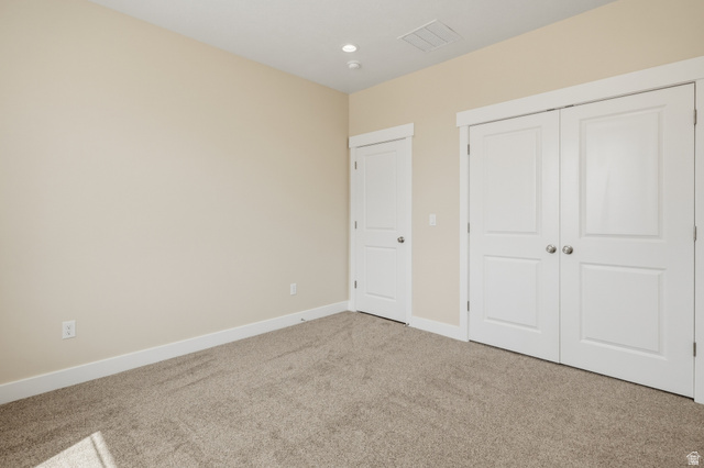 157 West 100 South Joseph, UT 84739 - Photo 24 of 30 Unfurnished bedroom featuring carpet flooring, a closet, and recessed lighting