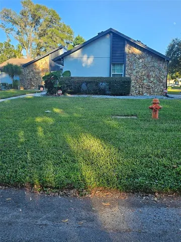 a view of a backyard of the house